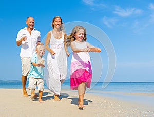 Family running on the beach Concept