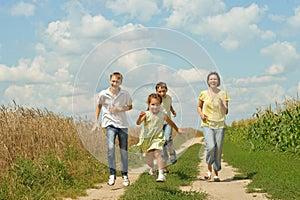 Family running on a dirt road