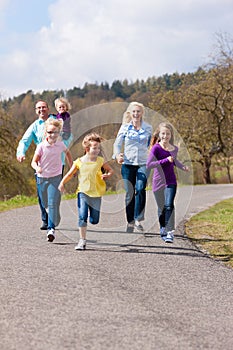 Family is running outdoors