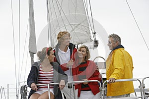 Family On Sailboat In Sea