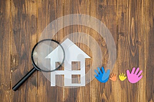 Family Searching house conceptual, paper house with Magnifier