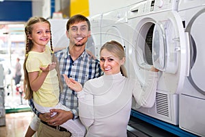 Family selecting laundry washer