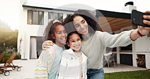 Family, selfie and children outdoor with a smile, love and care in home backyard. Face of young latino woman, woman or