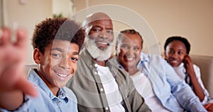 Family, selfie and face for photograph at home, happy and together to capture moment on sofa. Grandparents, children and
