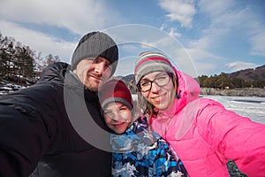 Family selfie at winter journey.