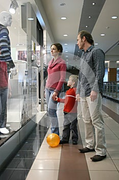 Family and shop window