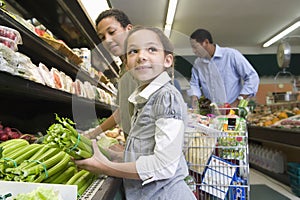 Family Shopping In Supermarket