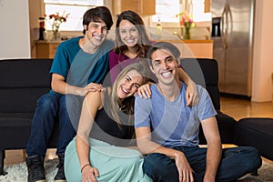 Family siblings at home smiling for a portrait love each other gathering reunion