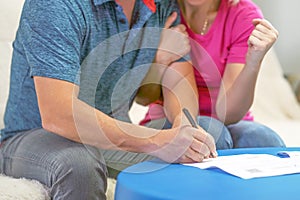 Family signs a document. Bank loan approvals