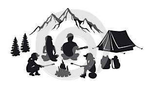 Family sit around campfire silhouette scene photo