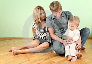 Family sit on floor
