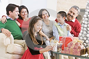 Family Sitting Around A Coffee Table