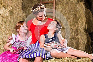 Family sitting on hayloft with gingerbread