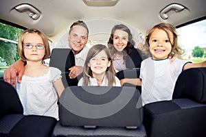 Family Sitting Inside Their Car