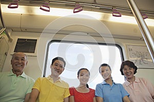 Family sitting in the subway, portrait