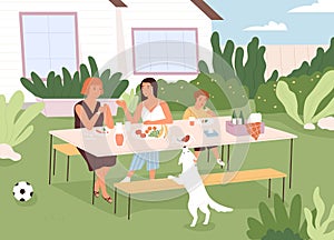 Family sitting at table in backyard of house, eating food and chatting. People and dog spending leisure time outside in