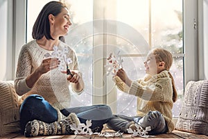 Family sitting by the window