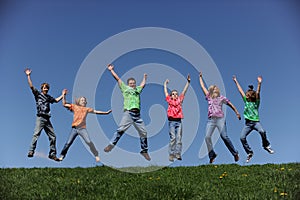 Family of six jumping and having fun
