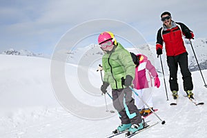 Family skiing on the slopes