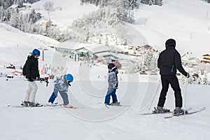 Family skiing together in austrian resort