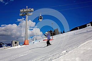 Family, skiing in winter ski resort on a sunny day, enjoying landscape