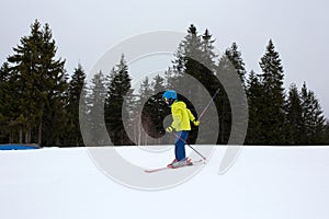 Family, skiing in winter ski resort on a sunny day, enjoying landscape