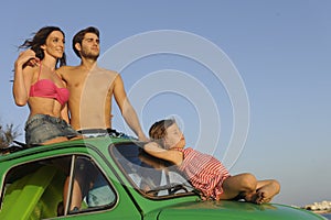 Family with small car on vacation