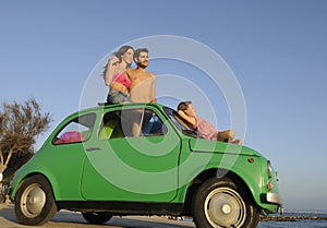 Family with small car on vacation