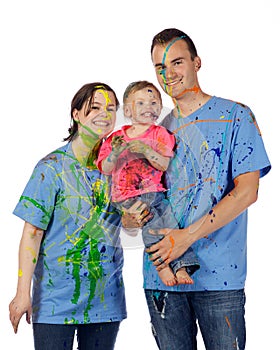 Family smiling after having a paint fight