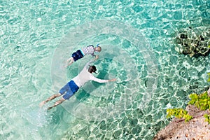 Family snorkeling at caribbean