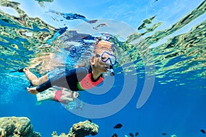 Family snorkeling in ocean