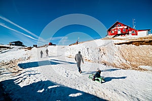 Family in snow at Cota 2000 Sinaia