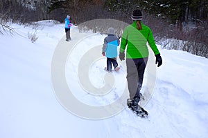 Family Snowshoeing in the Winter Snow