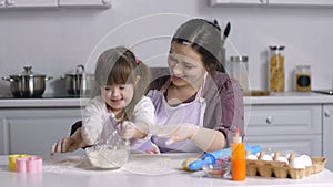 Family with special needs kid preparing bakery