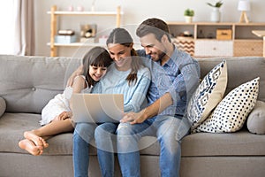 Family spend free time at home surfing internet