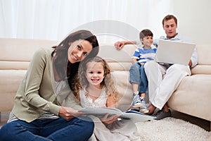 Family spending leisure time in the living room