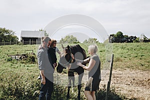 Family spending time in animal farm