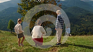 Family spending time nature with pedigree pet. People enjoying walking dog.