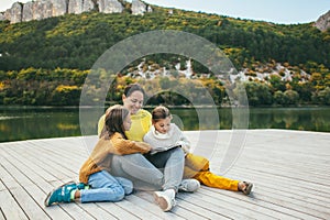 Family spending time together by the lake