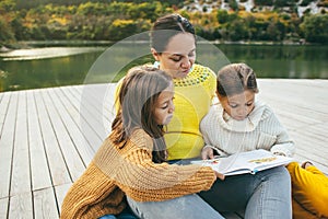 Family spending time together by the lake