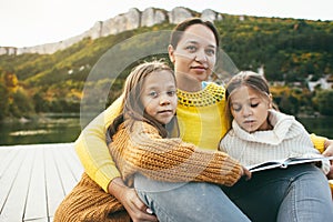 Family spending time together by the lake