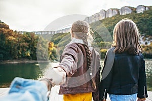 Family spending time together by the lake