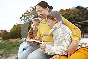 Family spending time together by the lake