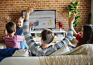 Family spending time together watching TV