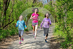 Family sport, happy active mother and kids jogging outdoors