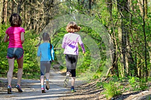 Family sport, happy active mother and kids jogging outdoors