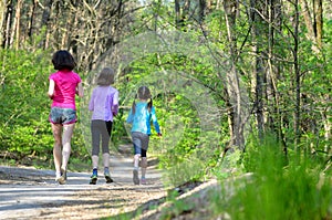 Family sport, happy active mother and kids jogging outdoors