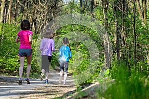 Family sport, happy active mother and kids jogging outdoors