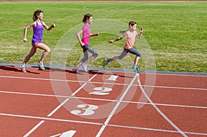 Family sport, mother and kids running on stadium track, training and children fitness