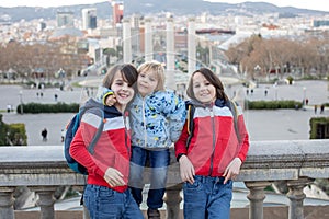 Family, standing in front of national museum in Barcelona, happy family holiday with children